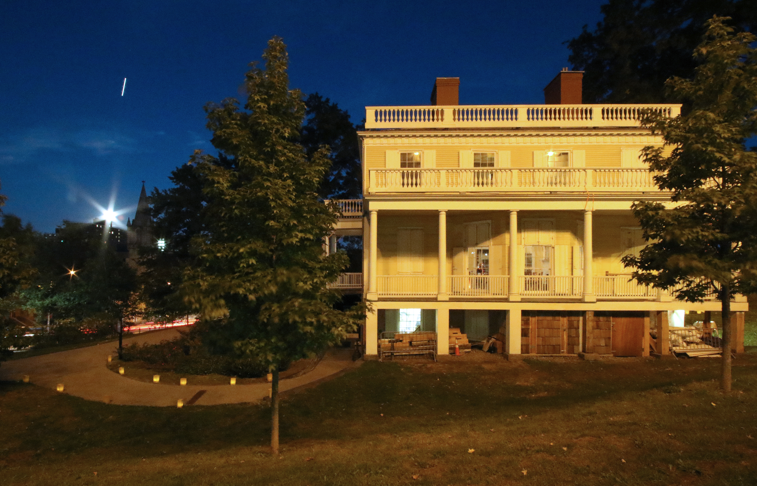 Historic house exterior with porch and trees, useful as a reference for a custom pencil house portrait
